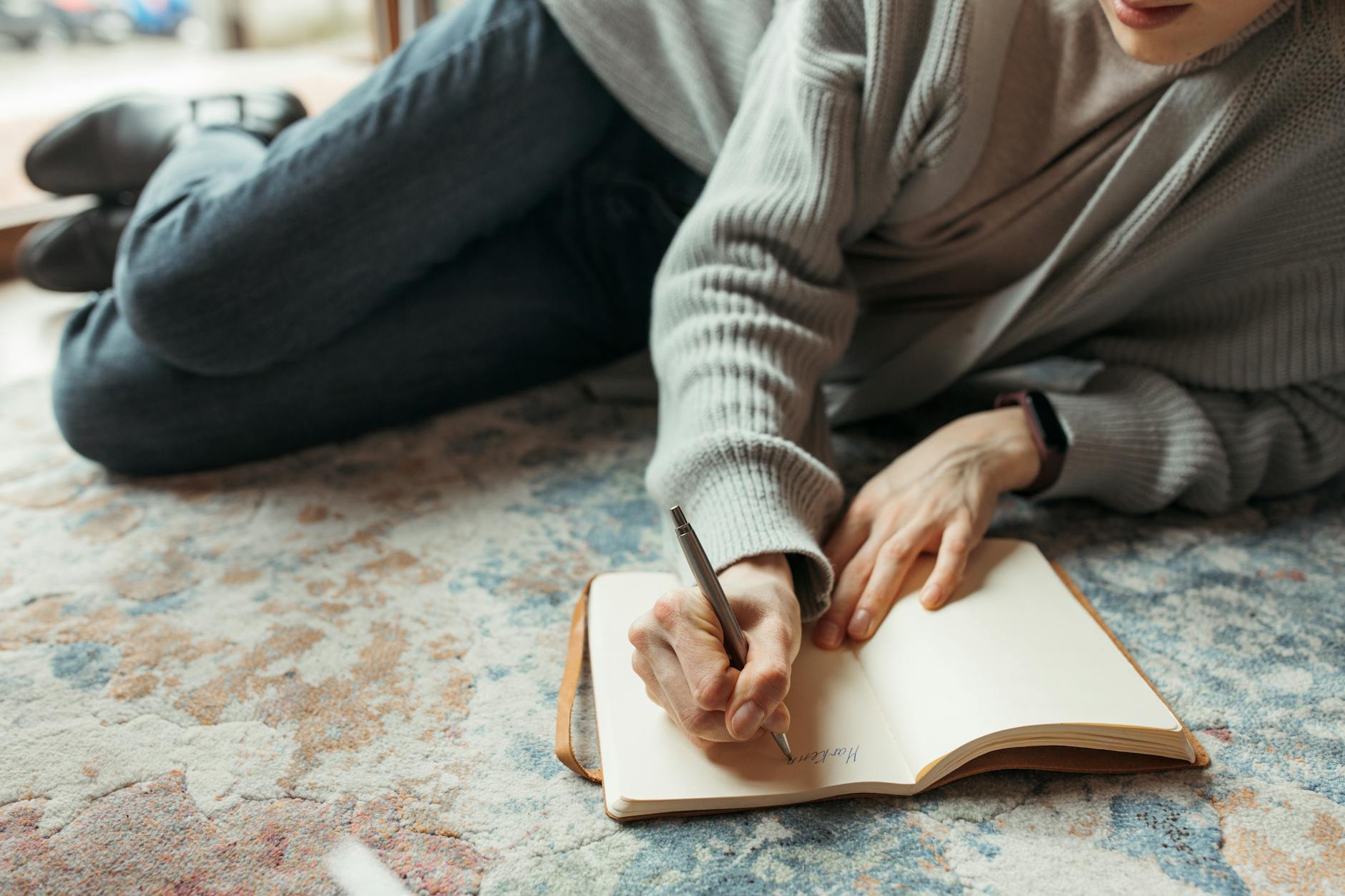 close up shot of person writing a diary